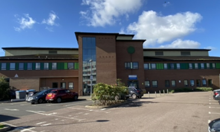 Picture of the Paybody building and its car park