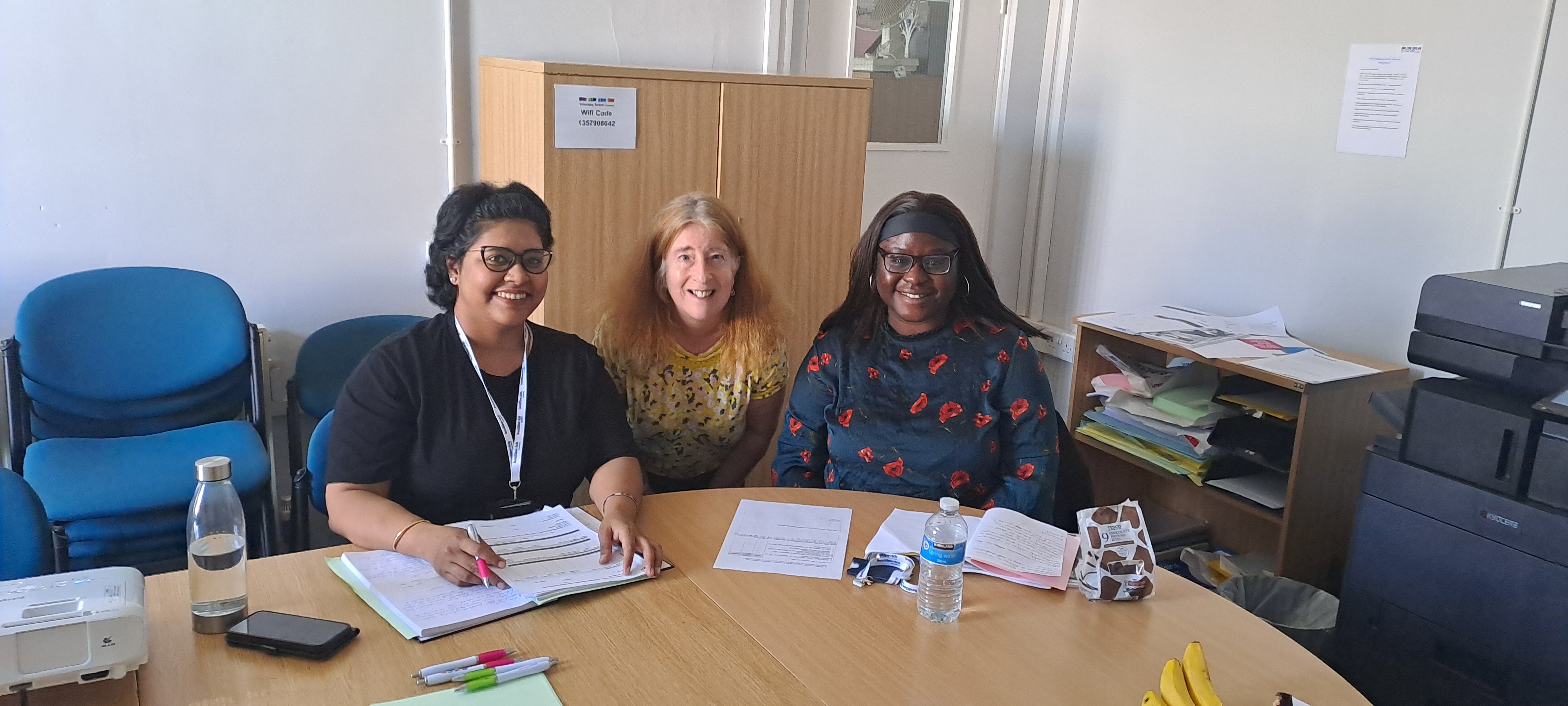 A photo of two volunteers taking part in Healthwatch training along with a staff member