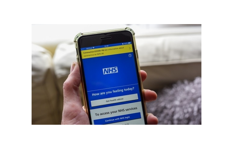 NHS_app_on_phone_in_hand