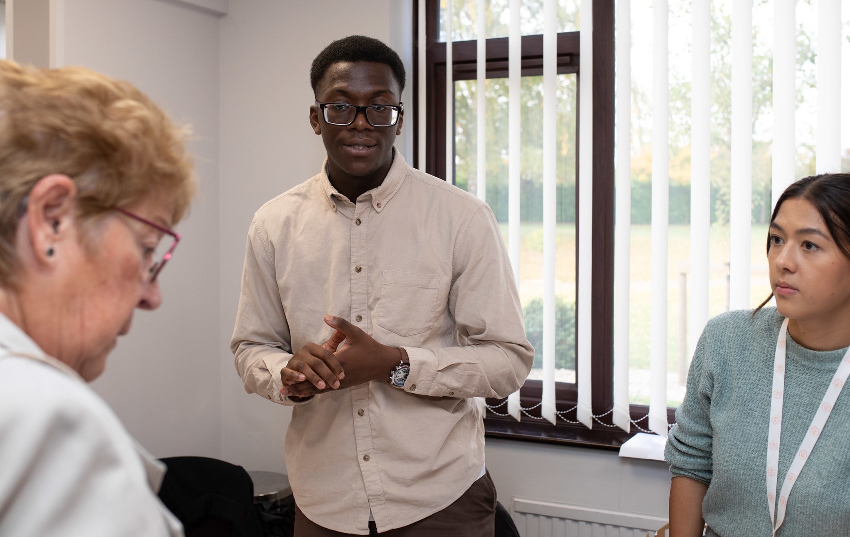 Picture of man talking to woman in an office