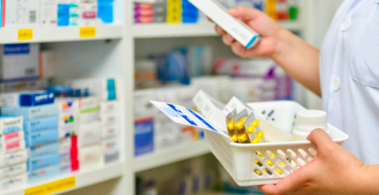 Image of a member of pharmacy staff sorting medication