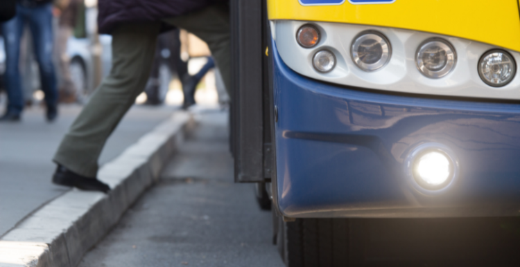 Image of a person stepping onto a bus