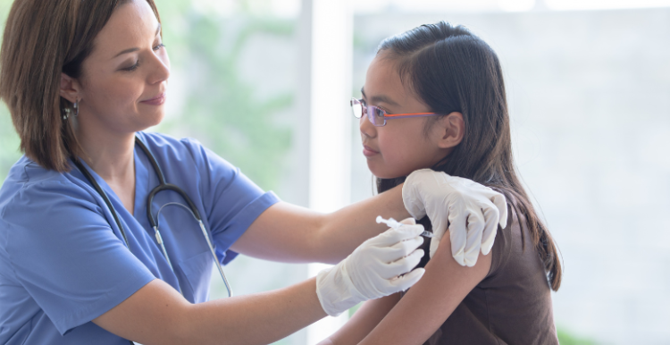 A young person getting a vaccination
