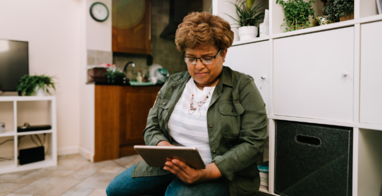 Lady using a tablet to book an appointment