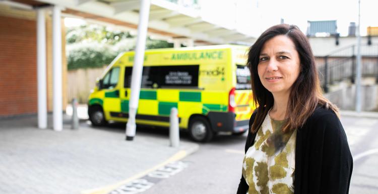 Woman standing in the ambulance bay of an A&E Woman standing in the ambulance bay of an A&E