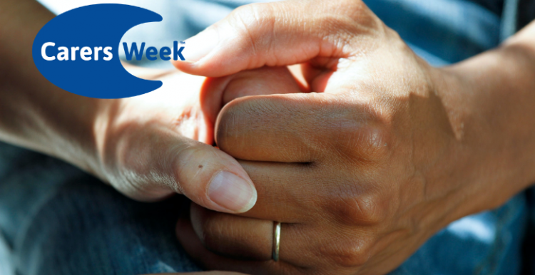 Carers Week 2021 Two people's hands clasped together to provide comfort. Logo for Carers Week in the top left corner.