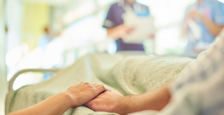 Holding hands with a family members at hospital visit