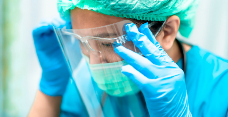 Personal Protective Equipment Person_wearing_face_shield_and_gloves