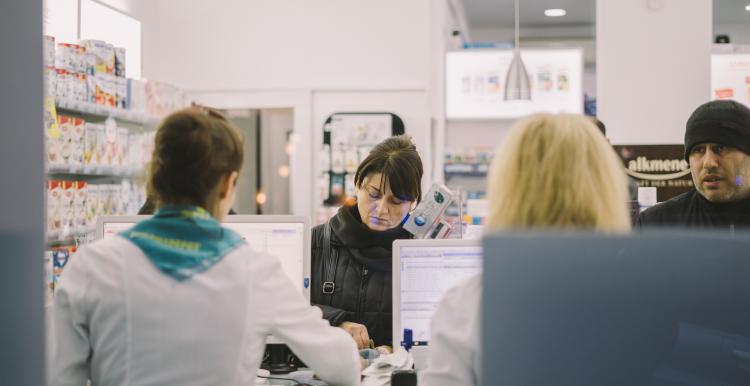 People visiting a pharmacy