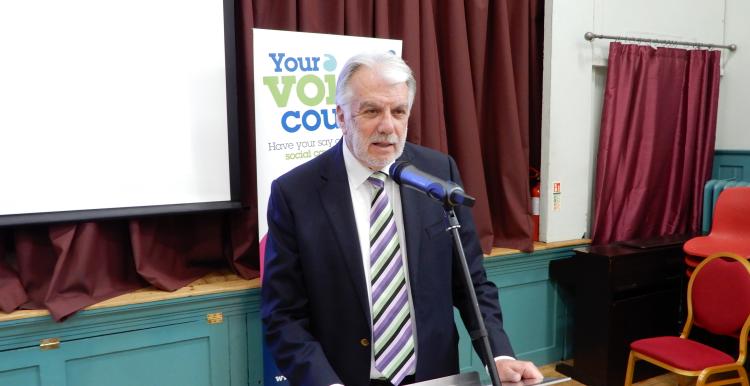 Chair of Healthwatch Coventry, Stuart Linnell, speaking at a meeting.