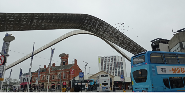 Coventry's Whittle Arch Coventry's whittle arch with people and buses passing by