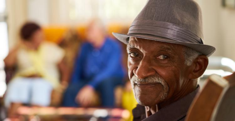 Picture of Older black man seated and smiling