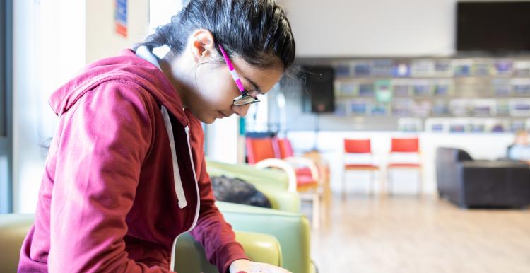 Young person using phone Young person using phone