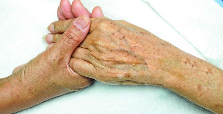 Picture of two hands clasped together