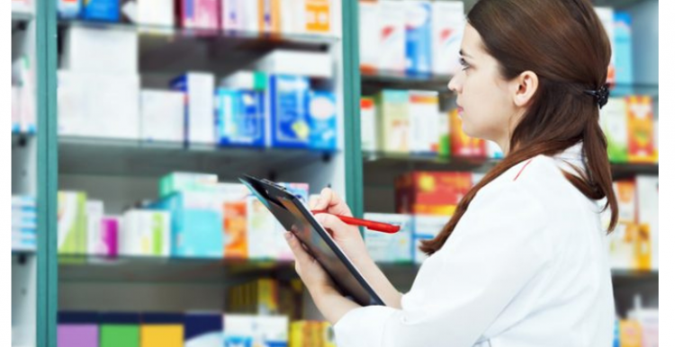 pharmacist and medication pharmacist_standing_in_front_of_medication
