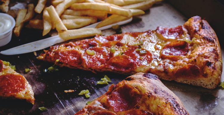 Image of pizza and fries in a box Image of pizza and fries in a box