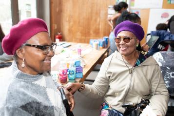 Two ladies talking to eachother at an event