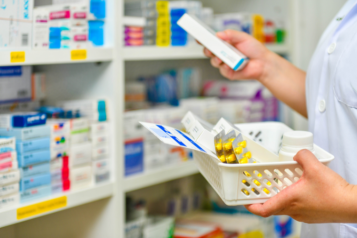 Image of a member of pharmacy staff sorting medication