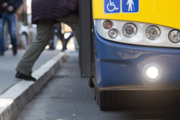 Image of a person stepping onto a bus
