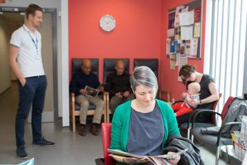 Woman reading a magzaine in a waiting room 