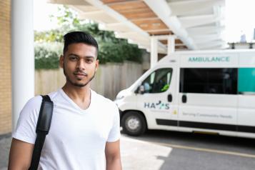 Man standing in front of an ambulance