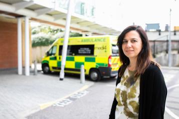 Woman standing in the ambulance bay of an A&E