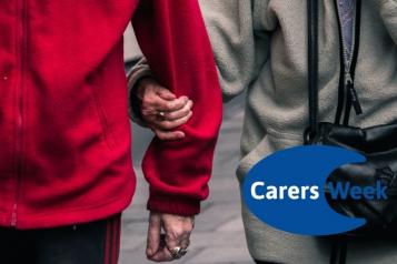 Image shows two elderly people walking together. The woman is holding the man's arm. The Carers Week logo is in the corner.