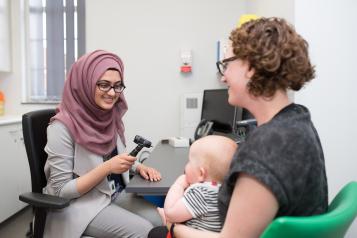 GP with a mother and baby patient 