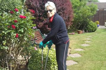 Lady outside gardening