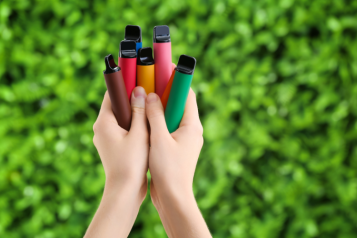 a hand holding vaping equipment