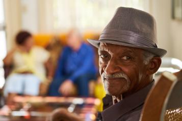 Picture of Older black man seated and smiling