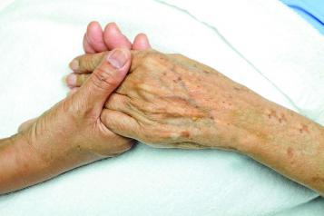 Picture of two hands clasped together