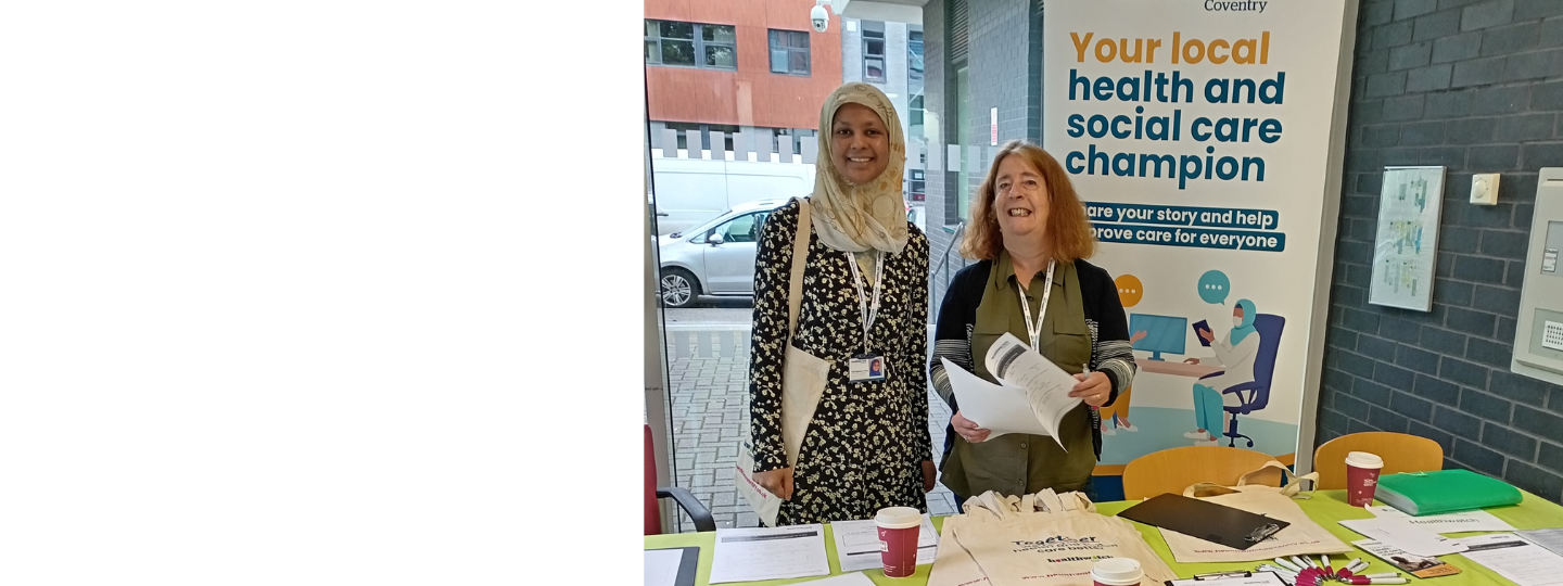 Healthwatch volunteer and staff member at an event