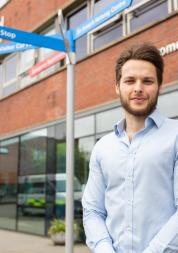 A man standing outside a hospital